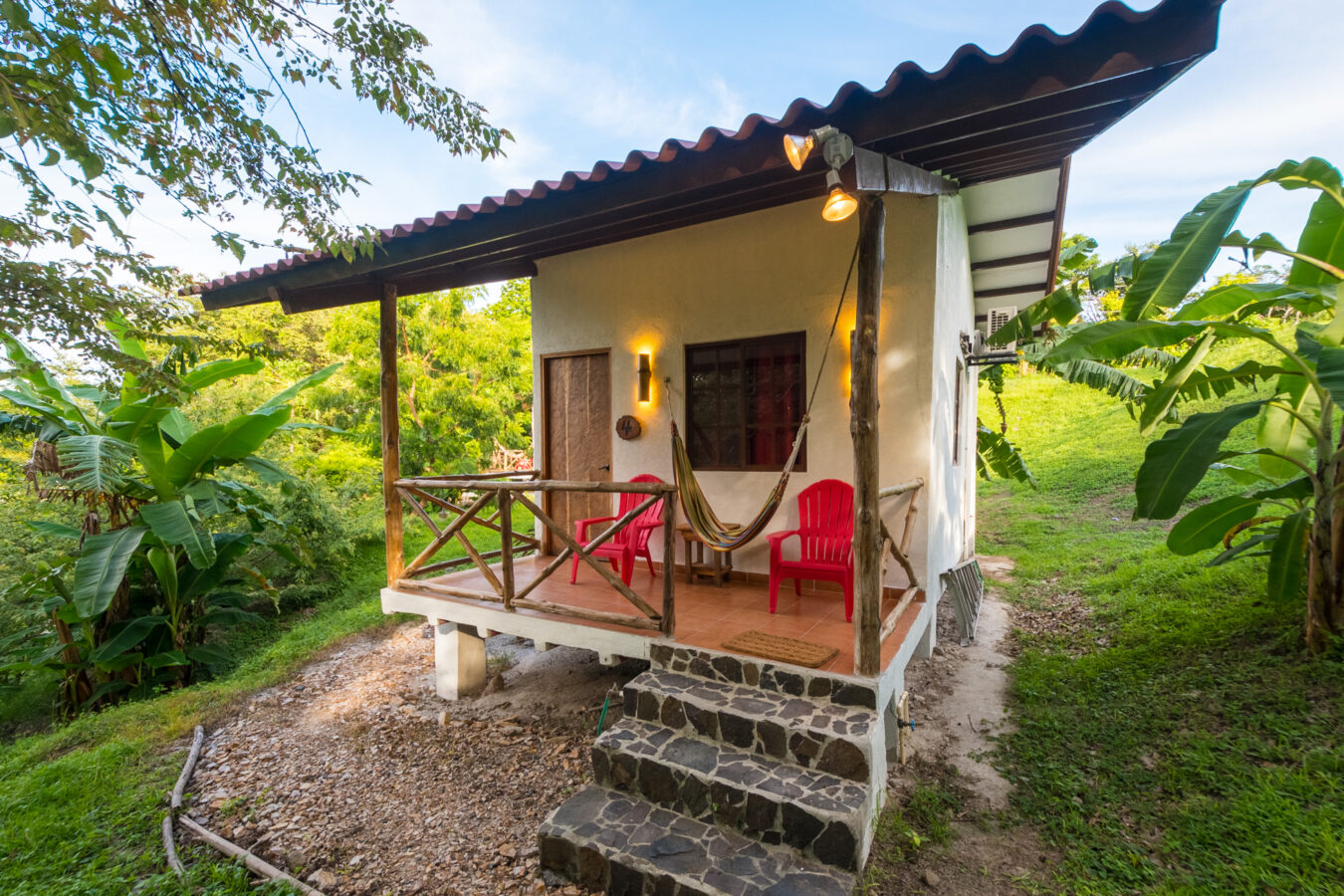 Enjoy Peaceful Simplicity and Comfort in our Jungle Cabins, steps away from a tropical beach.