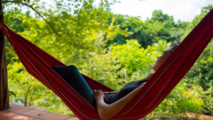 How to Plan a Stress-Free Family Adventure Vacation in Panama Relaxing in a hammock at Istmo retreat in Panama
