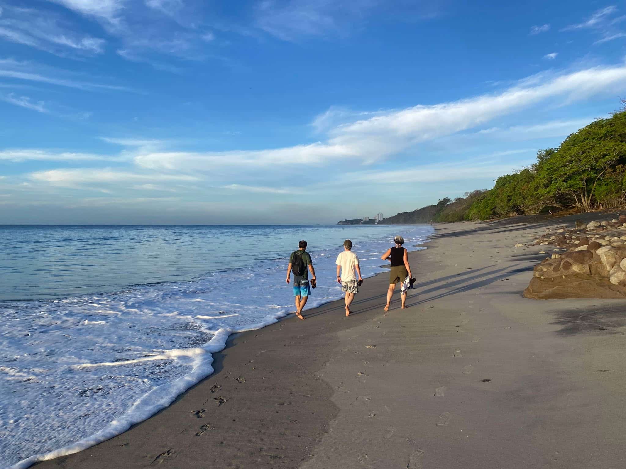 Istmo retreat guests strolling on the near-by sandy beach in Panama Istmo retreat guests strolling on the near-by sandy beach in Panama