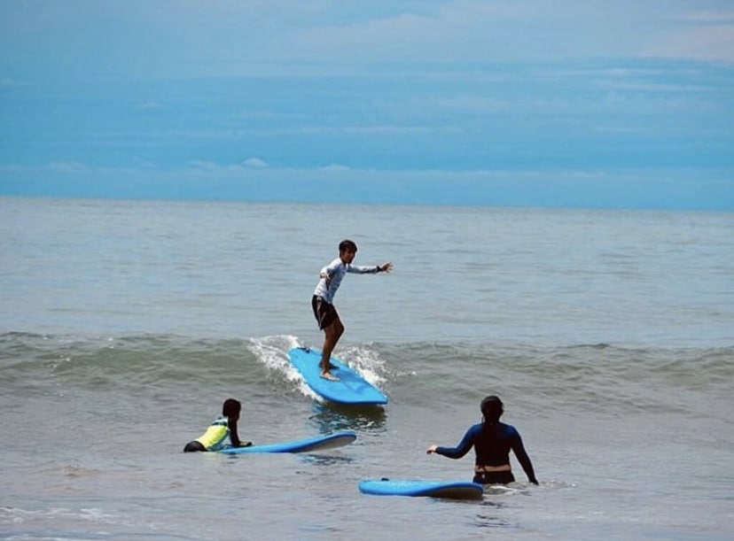 Surf Lessons in Panama | Family Adventure at Istmo Retreat & Adventures Kids learning to surf on the beach in Panama — part of the fun and family-friendly adventure activities offered by Istmo Retreat & Adventures.