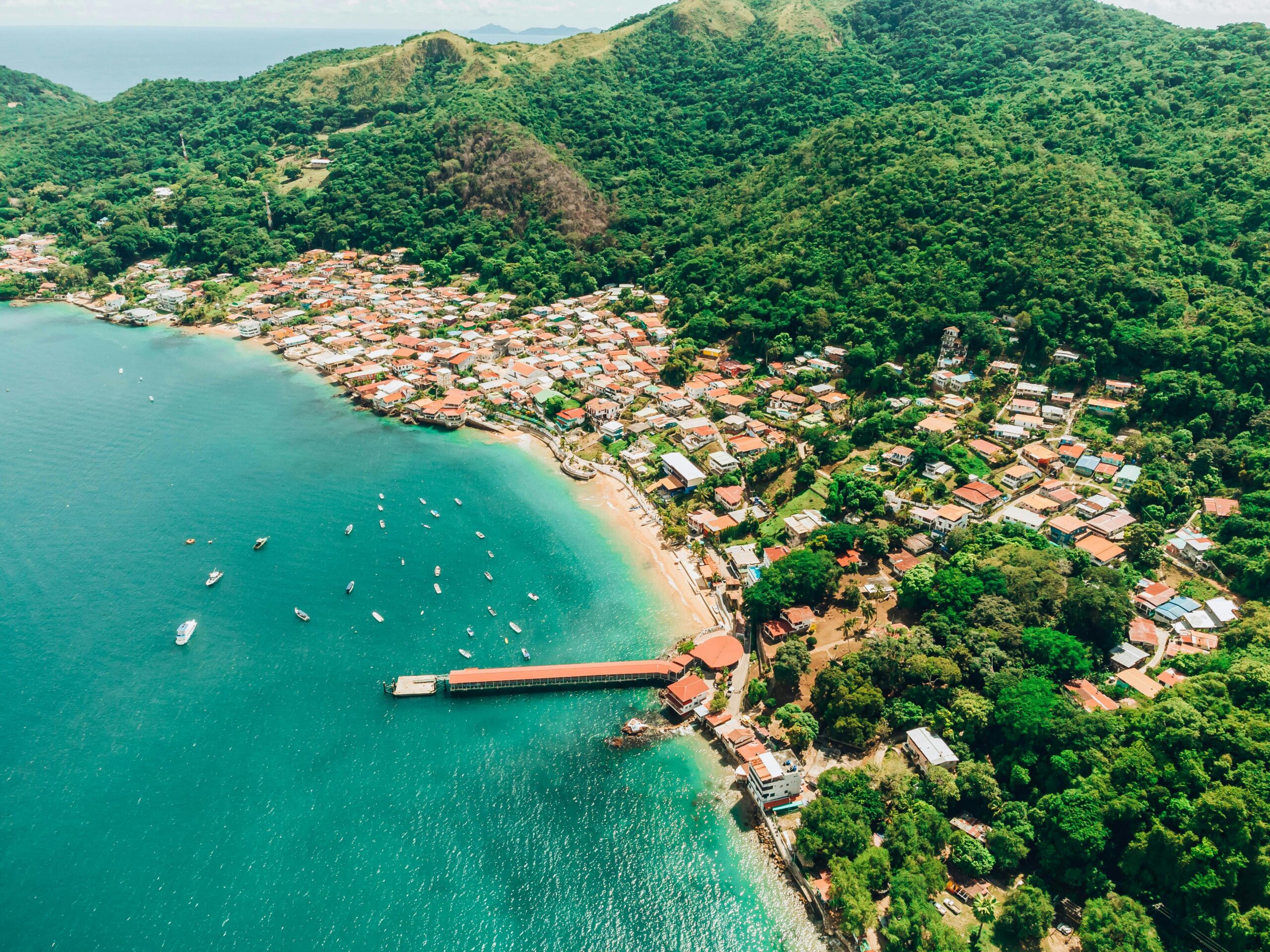panama-coastal-town-best-family-vacation-destination-photo-by-pexels-stiven-rivera Aerial view of a colorful coastal town in Panama surrounded by lush green hills and turquoise ocean—an ideal spring break destination for families and one of the best family vacation spots.
