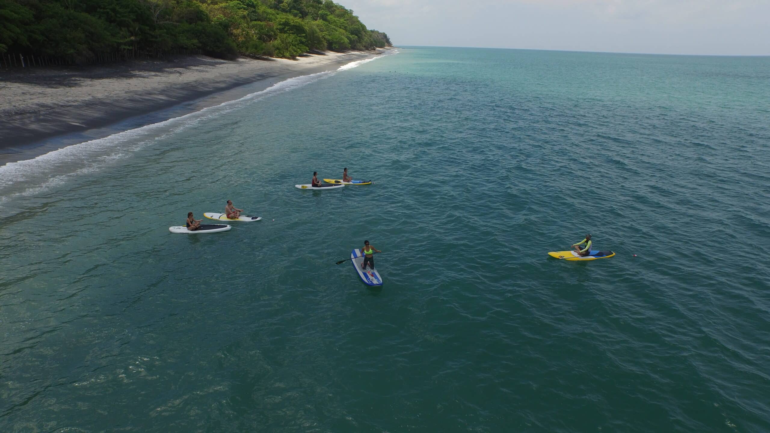 Group paddleboarding along the coast of Panama at Istmo Retreat & Adventures, a top destination for all-inclusive family vacations and family adventure holidays. Group paddleboarding along the coast of Panama at Istmo Retreat & Adventures, a top destination for all-inclusive family vacations and family adventure holidays.