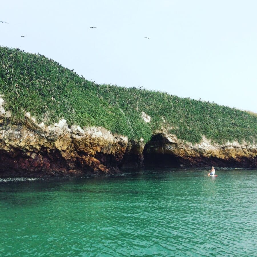 sup-ocean-caves-all-inclusive-family-vacation Paddleboarding near ocean caves in Panama, part of an all-inclusive family vacation package.